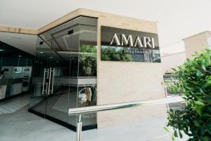 a building with a sign that reads amarilla at Amari Living Suites in Barranquilla