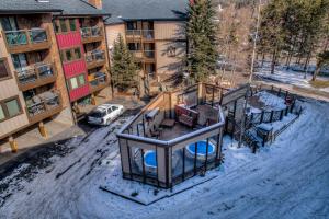 an aerial view of a apartment complex in the snow at Top Floor 2 Bedroom Ski-In & Walk to Main St in Breckenridge