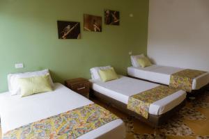 Letto o letti in una camera di Tuki Hostel & Lounge