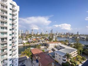 an aerial view of a city with a river and buildings at Riverside 2BR delicate apt in Gold Coast
