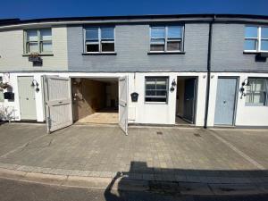 a house with a garage with two doors at 3 BEDROOMS WITH 2 PARKING SPACES in Brighton & Hove