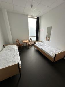 Postel nebo postele na pokoji v ubytování Arena Hostel & Monteurzimmer
