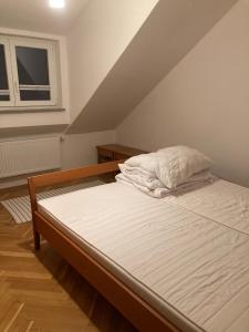 a bed in a room with a attic at Apartment in Ossiach in Altossiach