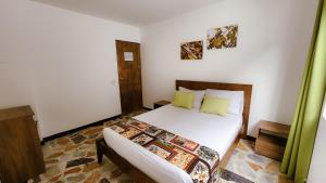 Letto o letti in una camera di Tuki Hostel & Lounge