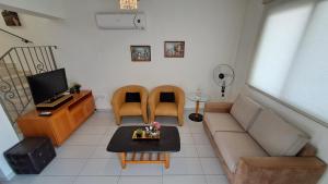 TV a/nebo společenská místnost v ubytování Dream beach house Pernera