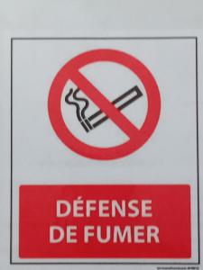 a sign that says defense be furnace and a no smoking sign at Monte Cristo in Metz