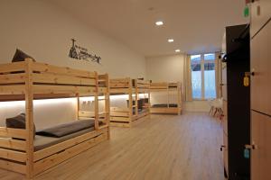 a room with four bunk beds in a room at Apartment im Fun4you in Wiesloch