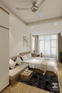 Giường trong phòng chung tại NB APARTMENT-LINH LANG