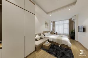 Giường trong phòng chung tại NB APARTMENT-LINH LANG