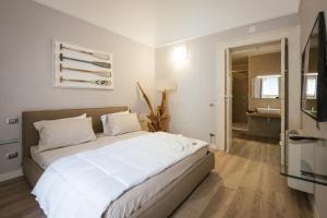 Postel nebo postele na pokoji v ubytování Calefati SUITE 54