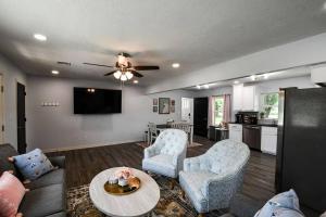 a living room with a couch and chairs and a table at The Mayor in Gore in Gore