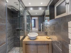 a bathroom with a sink and a shower at Appartement Courchevel 1850, 4 pièces, 6 personnes - FR-1-564-36 in Courchevel