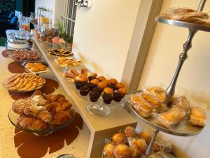 a buffet of pastries and pastries on a table at Garda Dream in Lazise