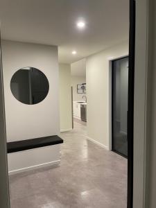 a living room with a black bench and a window at Beckford House in Methven