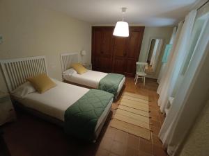 מיטה או מיטות בחדר ב-Casa Peratallada