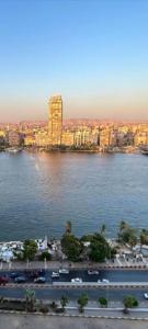 a view of a city and a large body of water at Nile Star Suites & Apartments in Cairo