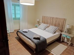 מיטה או מיטות בחדר ב-Casa Peratallada