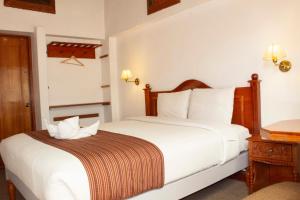 Letto o letti in una camera di Hotel Amerinka