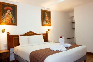 Letto o letti in una camera di Hotel Amerinka