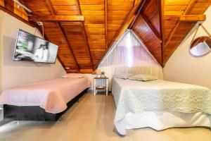 Krevet ili kreveti u jedinici u okviru objekta 271 - Loft em Residencial com Piscina a 200m da Praia