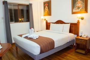 Letto o letti in una camera di Hotel Amerinka