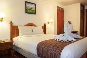 Letto o letti in una camera di Hotel Amerinka