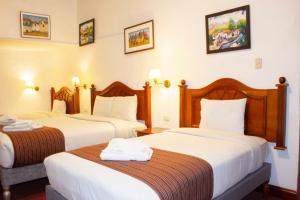 Letto o letti in una camera di Hotel Amerinka