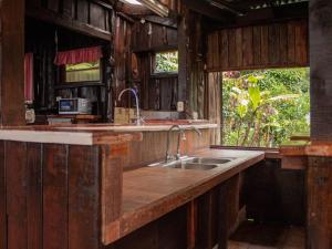 a kitchen with a sink and a counter top at La Cabaña - Parque Eólico in Santa Ana