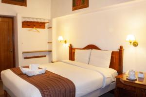 Letto o letti in una camera di Hotel Amerinka