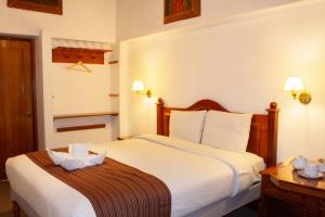 Letto o letti in una camera di Hotel Amerinka