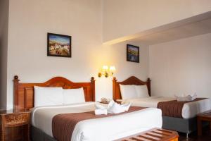 Letto o letti in una camera di Hotel Amerinka