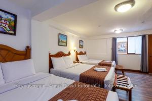 Letto o letti in una camera di Hotel Amerinka