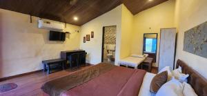 Postel nebo postele na pokoji v ubytování Mysticstays Resort