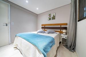 Ένα ή περισσότερα κρεβάτια σε δωμάτιο στο 272 - Apartamento com 02 dormitórios a 200m da Praia de Canto Grande