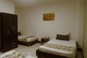 Letto o letti in una camera di Tuki Hostel & Lounge