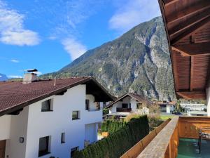 a view of the mountains from the balcony of a house at Apartment Buntweg-1 by Interhome in Zams