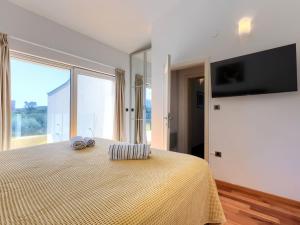 TV a/nebo společenská místnost v ubytování Holiday Home Lana by Interhome