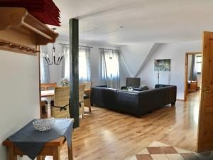 a living room with a couch and a table at Apartment Rügen by Interhome in Dargun