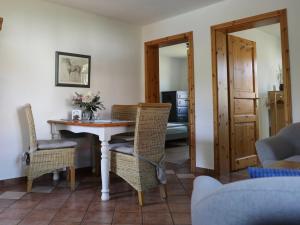 a dining room with a table and chairs at Apartment Fehmarn by Interhome in Dargun +19 photos