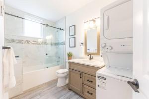 a bathroom with a sink toilet and a shower at Cozy Haven in Port Hope: Explore, Relax, Recharge in Port Hope