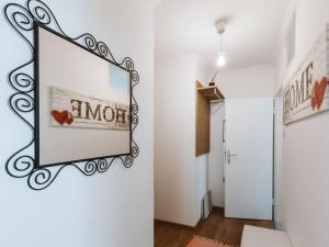 a mirror hanging on a wall in a hallway at Apartment Stubner Kogel Top 18 by Interhome in Bad Gastein