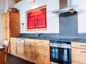 a kitchen with a sink and a stove at Chalet Sebas by Interhome in Nendaz