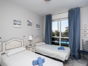 Posteľ alebo postele v izbe v ubytovaní Apartment Lorcrimar II by Interhome