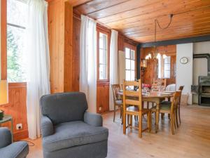 a kitchen and dining room with a table and chairs at Chalet Dufaux by Interhome in Champex