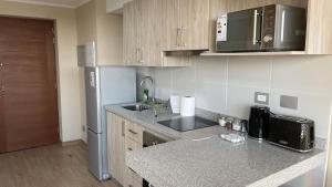 Kuchyň nebo kuchyňský kout v ubytování Depto central, parking, moderno