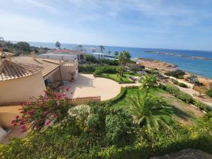 an aerial view of a resort with the ocean at Holiday Home Las Gaviotas Style & Charm by Interhome in Colònia de Sant Jordi