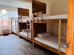Un ou plusieurs lits dans un hébergement de l'établissement Merakai Hostel Rincon del Mar