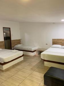 Postel nebo postele na pokoji v ubytování Hotel Agroturistico Palma Vino