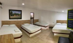 Postel nebo postele na pokoji v ubytování Hotel Agroturistico Palma Vino
