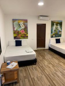 Postel nebo postele na pokoji v ubytování Hotel Agroturistico Palma Vino